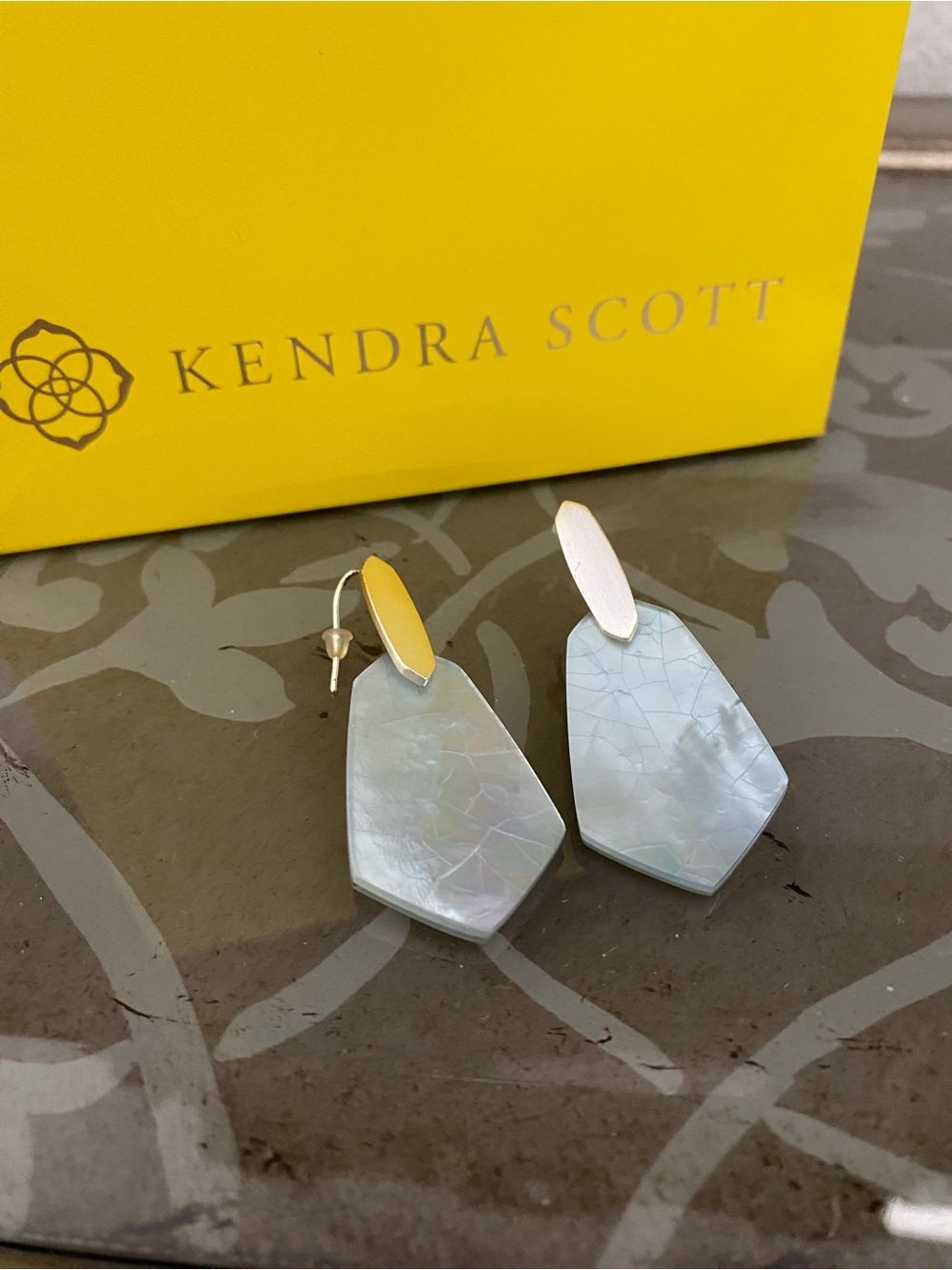 Kendra Scott Camila earrings 
Beautiful blue stone with gold tone
Excellent